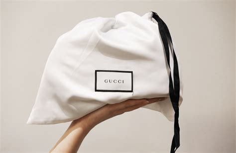 white gucci dust bag|how to clean gucci bag.